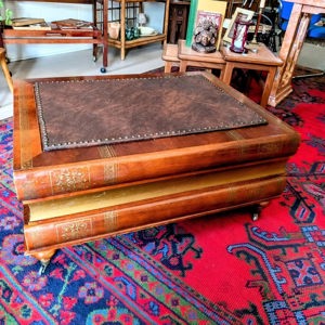 Maitland-Smith style 3-drawer stacked book coffee table with tooled leather top
