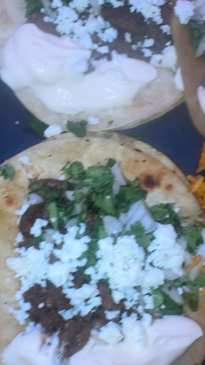 Golden Crown Steak Tacos plate with yellow rice and street corn