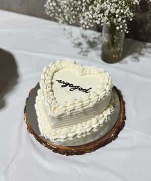 Custom event cake with matching cupcakes