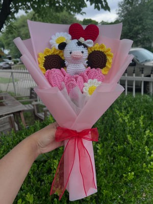 Crochet cow with flowers