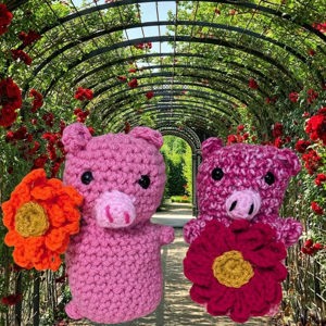 Crochet pig with zinnia flower