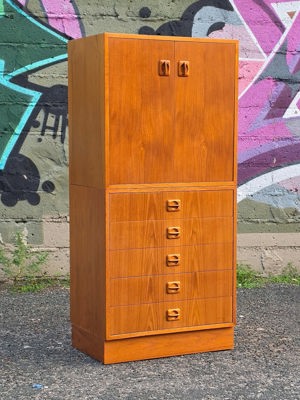 Stacked teak cabinet with interchangeable drawer/door base